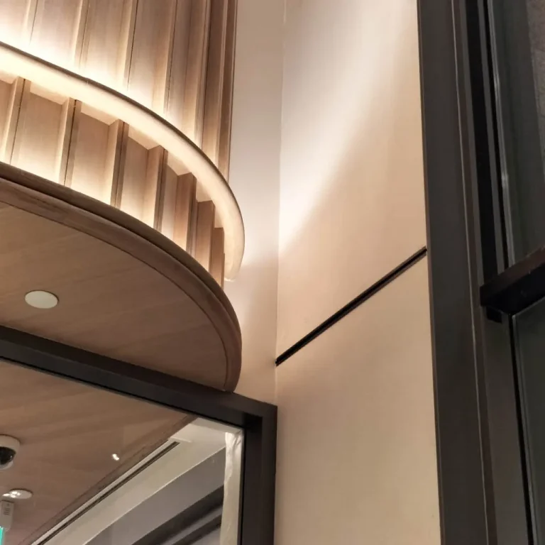 Smooth marble cladding on office lobby wall
